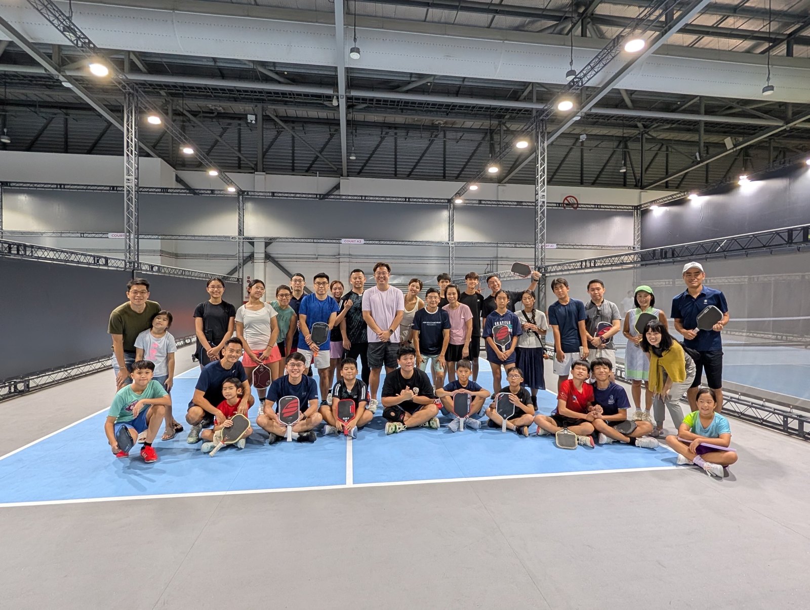 Juniors, parents and coaches together after JPI's first indoor pickleball session
